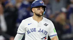 Bo Bichette #11 of the Blue Jays hits a three-run home run against Shohei Ohtani.