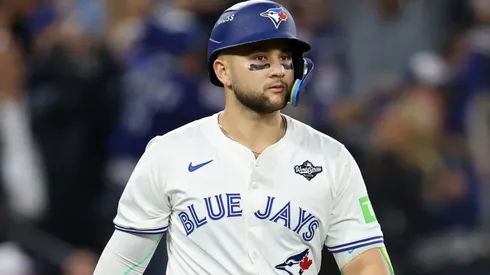 Bo Bichette #11 of the Blue Jays hits a three-run home run against Shohei Ohtani.