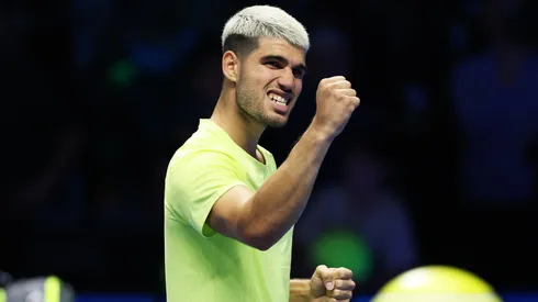 Carlos Alcaraz celebrates after winning a game at the ATP Finals.