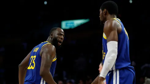Draymond Green #23 of the Golden State Warriors reacts to Jonathan Kuminga #1.