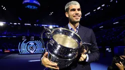 Carlos Alcaraz holds the 2025 Year-End ATP World No.1 Trophy.