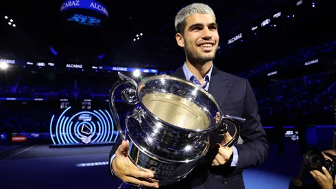 Carlos Alcaraz holds the 2025 Year-End ATP World No.1 Trophy.