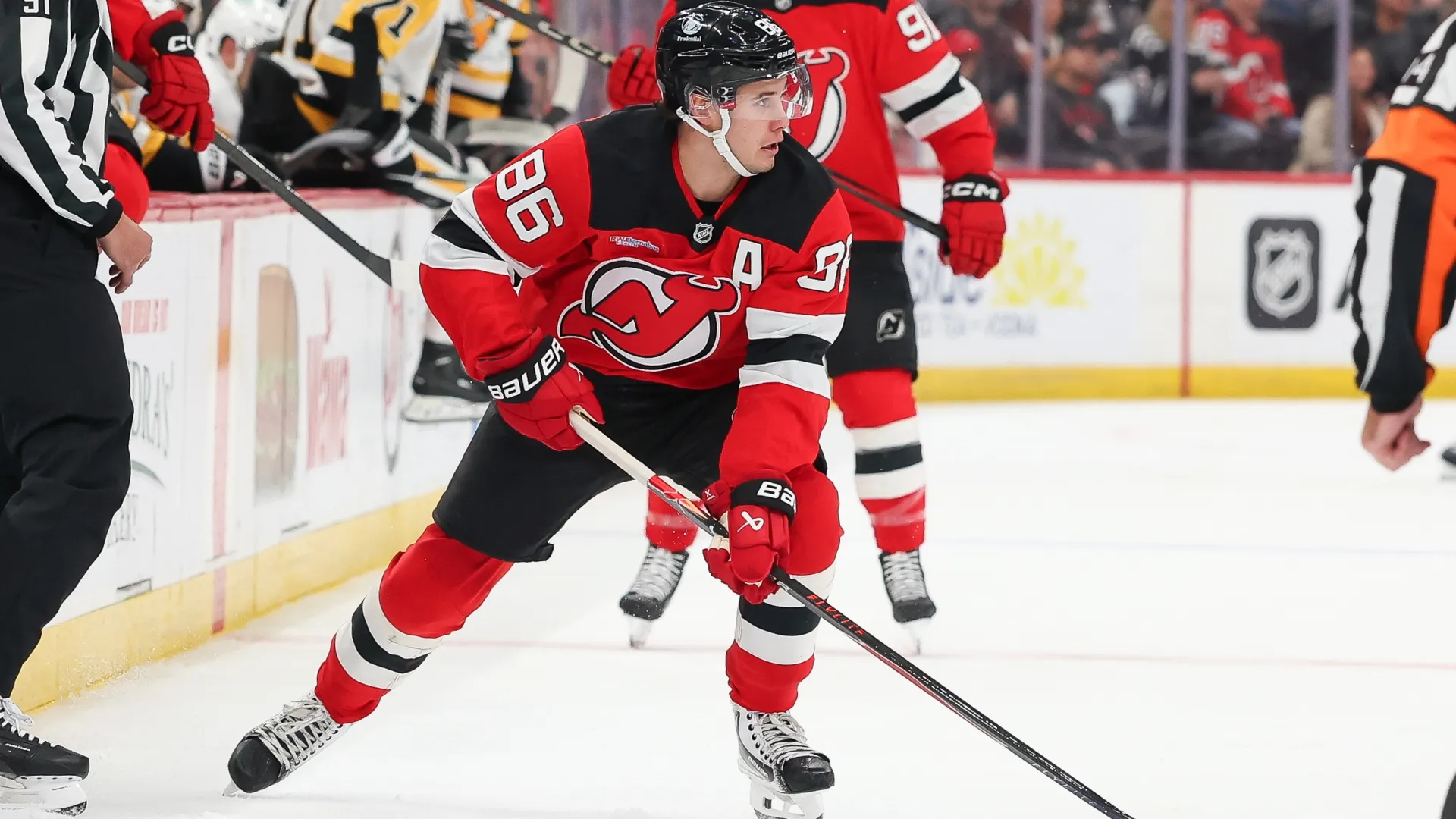 Jack Hughes #86 of the New Jersey Devils skates with the puck. Andrew Mordzynski/Getty Images