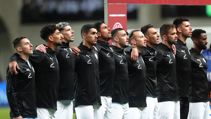 Players of Israel line up for the national anthem.