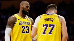 LeBron James #23 and Luka Doncic #77 of the Los Angeles Lakers react.