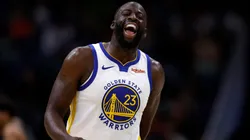 Draymond Green #23 of the Golden State Warriors interacts with a fan.