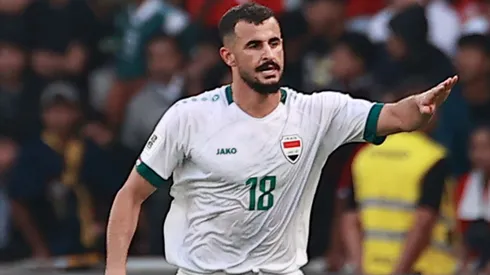 Aymen Hussein of Iraq #18 celebrates a goal.