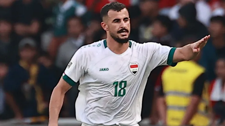 Aymen Hussein of Iraq #18 celebrates a goal.