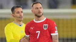 Marko Arnautovic of Austria is shown a yellow card.