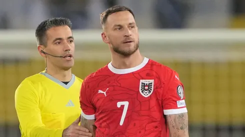 Marko Arnautovic of Austria is shown a yellow card.