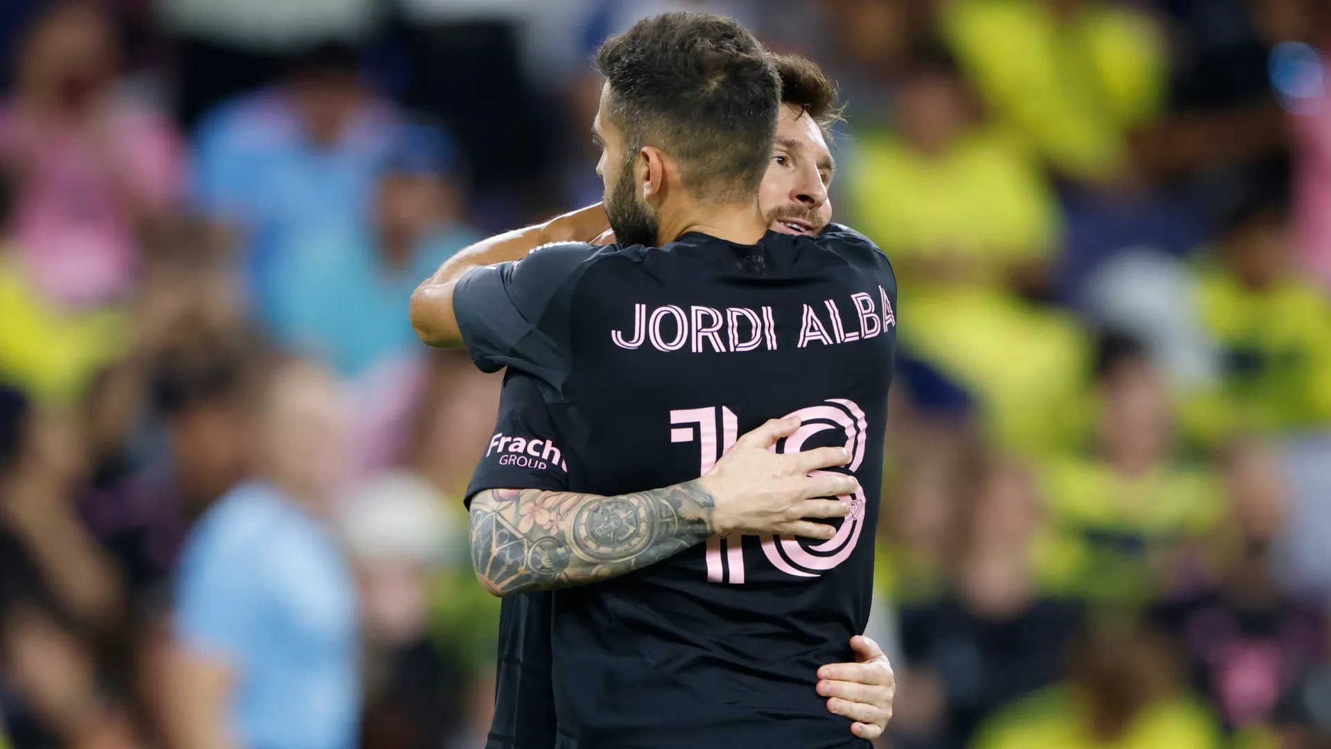 Lionel Messi celebrates a goal with Jordi Alba. (Getty Images)