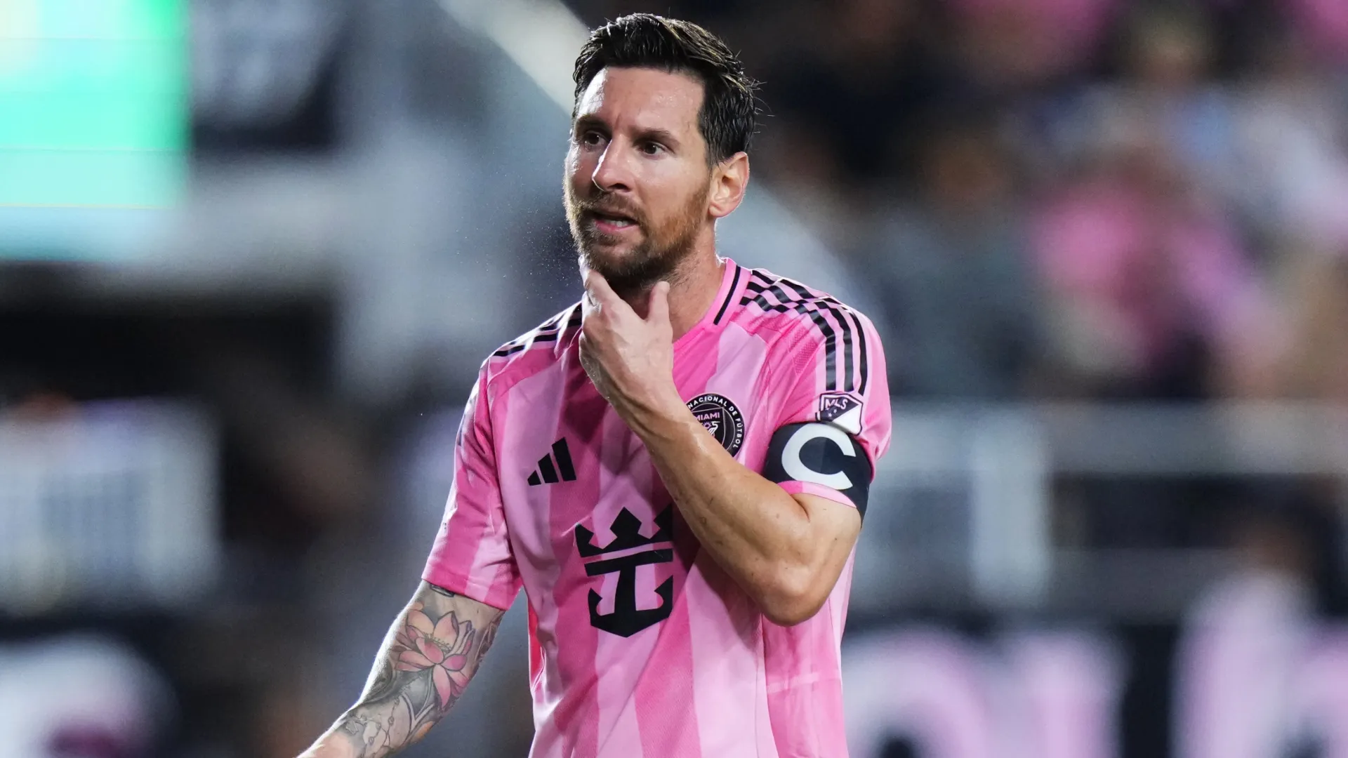 Lionel Messi looks on