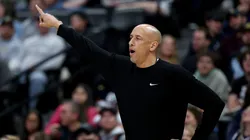 Head coach Doug Christie of the Sacramento Kings delivers instructions.