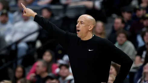 Head coach Doug Christie of the Sacramento Kings delivers instructions.