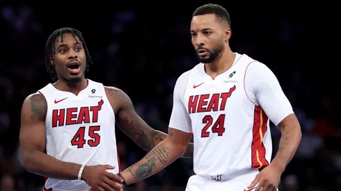 Davion Mitchell and Norman Powell react during an NBA game.