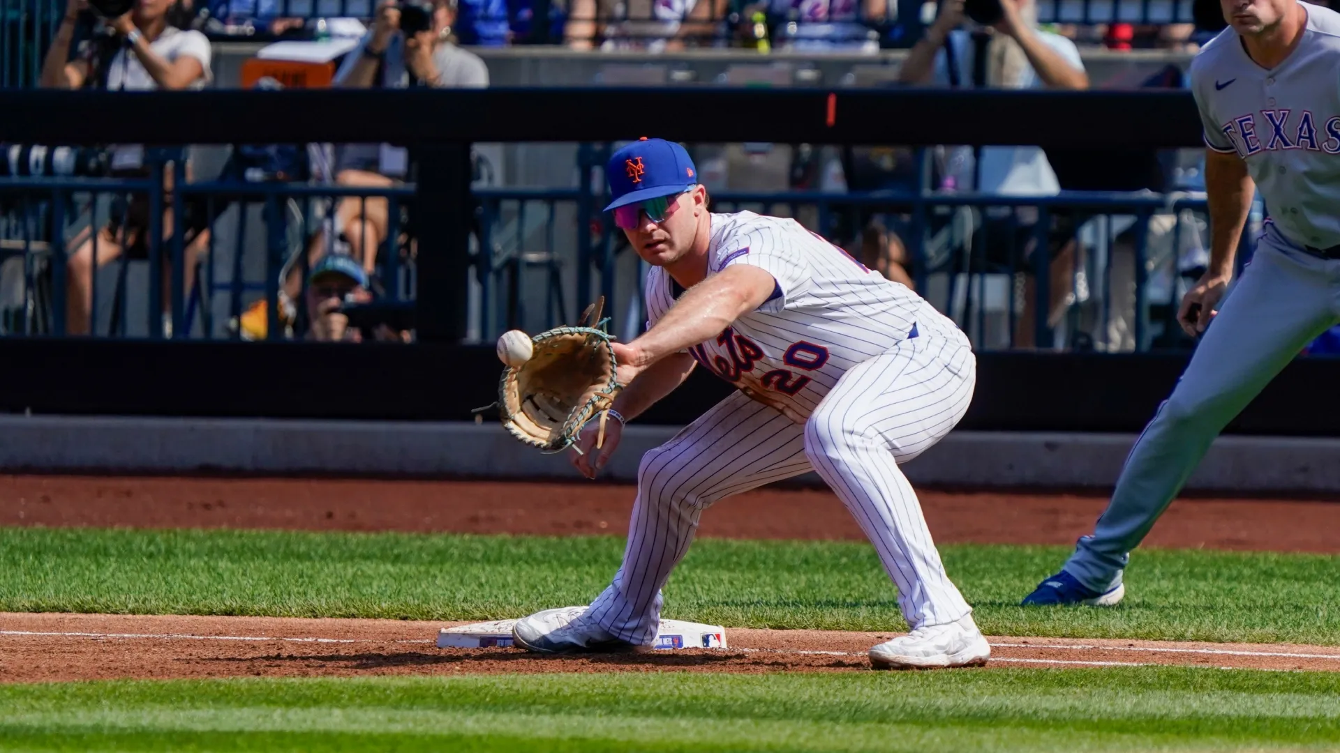 Pete Alonso #20 of the Mets catches the ball to get an out against the Rangers. Benjamin B. Braun/Getty Images