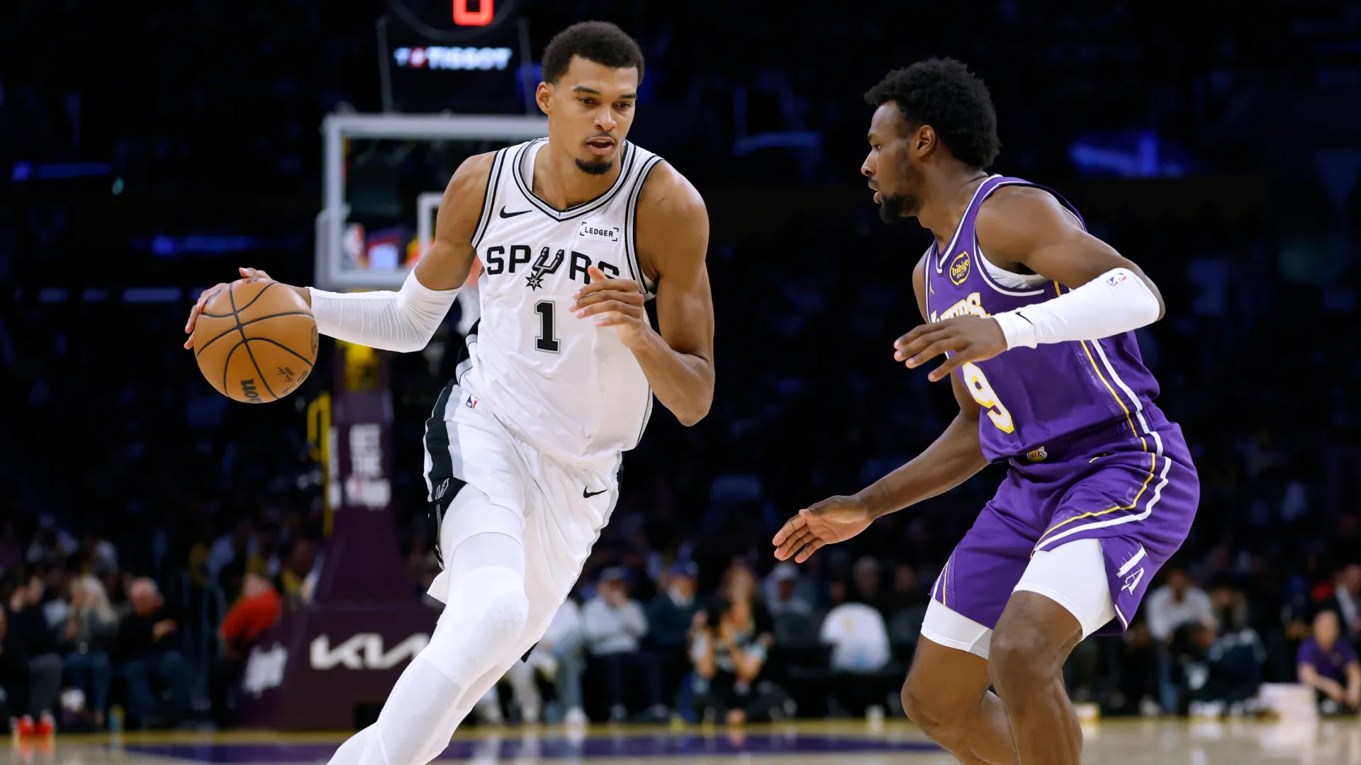 Victor Wembanyama dribbles against Bronny James. (Getty Images)