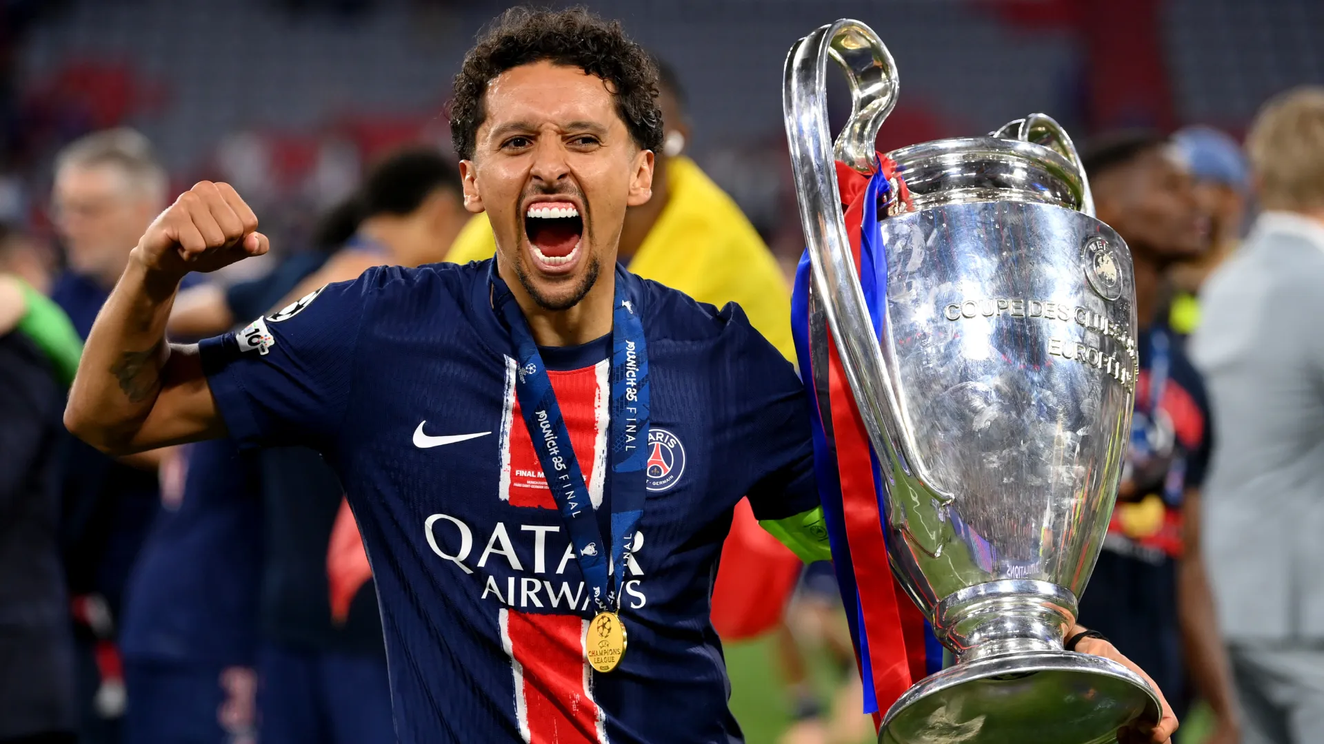 Marquinhos of Paris Saint-Germain celebrates with the UEFA Champions League trophy. (Getty Images)
