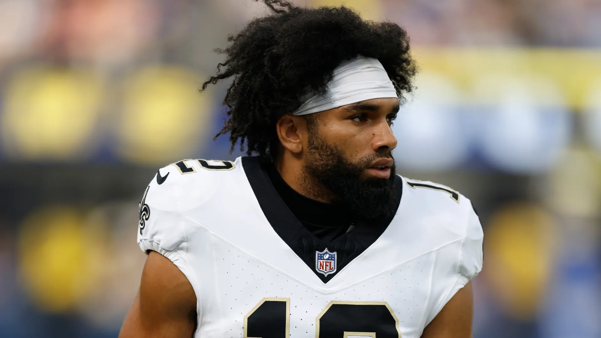 Chris Olave looks on