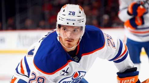 Jack Roslovic #28 of the Oilers skates against the Devils.