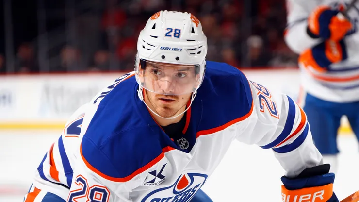 Jack Roslovic #28 of the Oilers skates against the Devils.