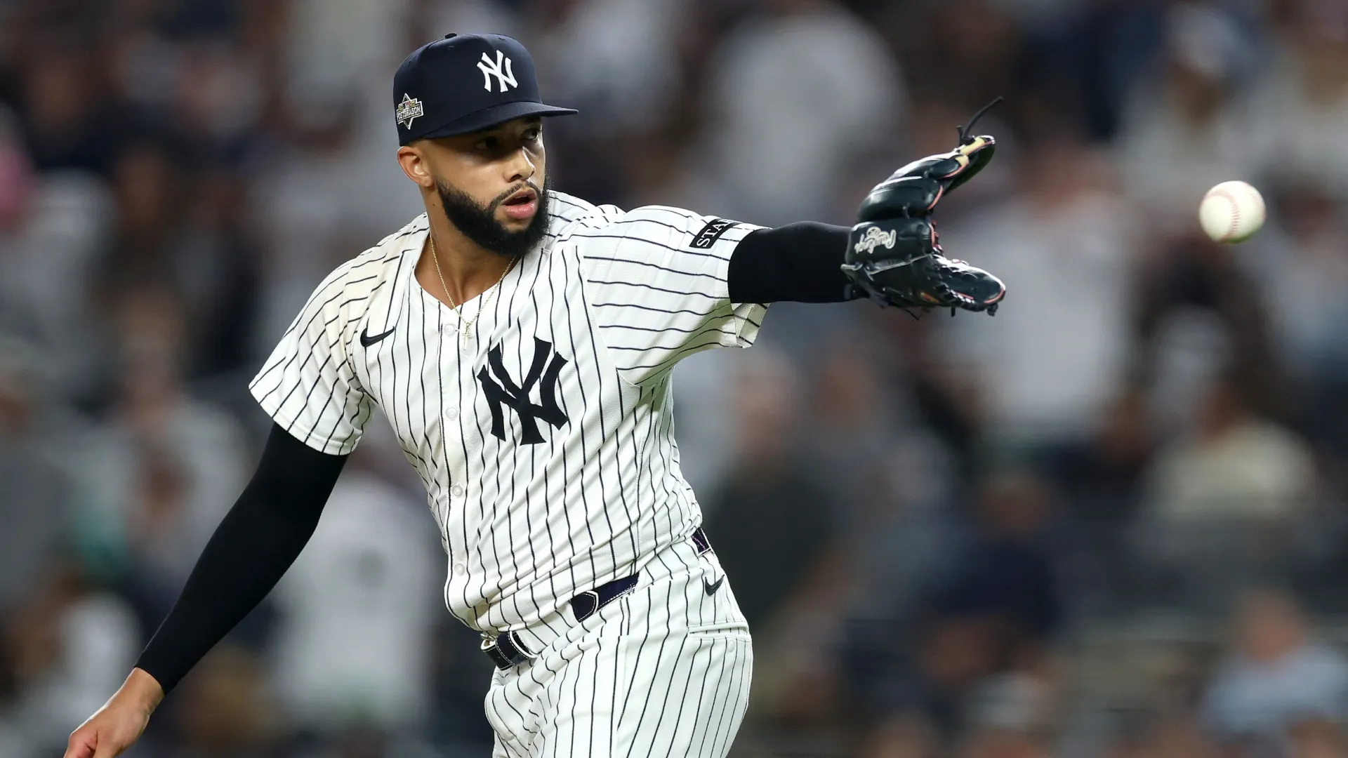 Devin Williams #38 of the New York Yankees catches a ball after a pitch.  Ishika Samant/Getty Images