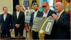 FIFA President Gianni Infantino talks as he and U.S. President Donald Trump hold a large World Cup ticket