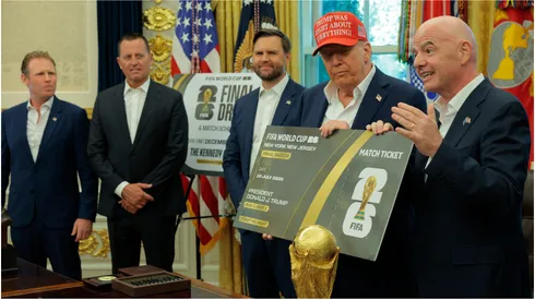 FIFA President Gianni Infantino talks as he and U.S. President Donald Trump hold a large World Cup ticket