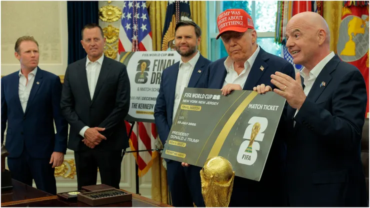 FIFA President Gianni Infantino talks as he and U.S. President Donald Trump hold a large World Cup ticket