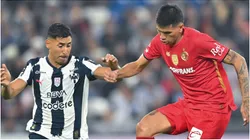 Ricardo Chávez of Monterrey fights for the ball with Nicolás Castro of Toluca
