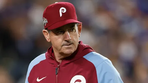 Manager Rob Thomson looks on.