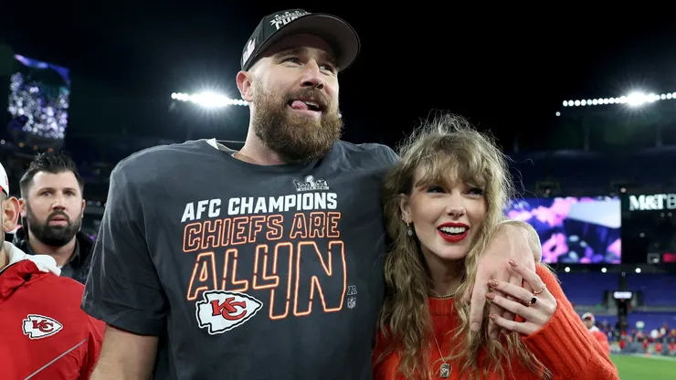 Travis Kelce #87 of the Kansas City Chiefs celebrates with Taylor Swift.