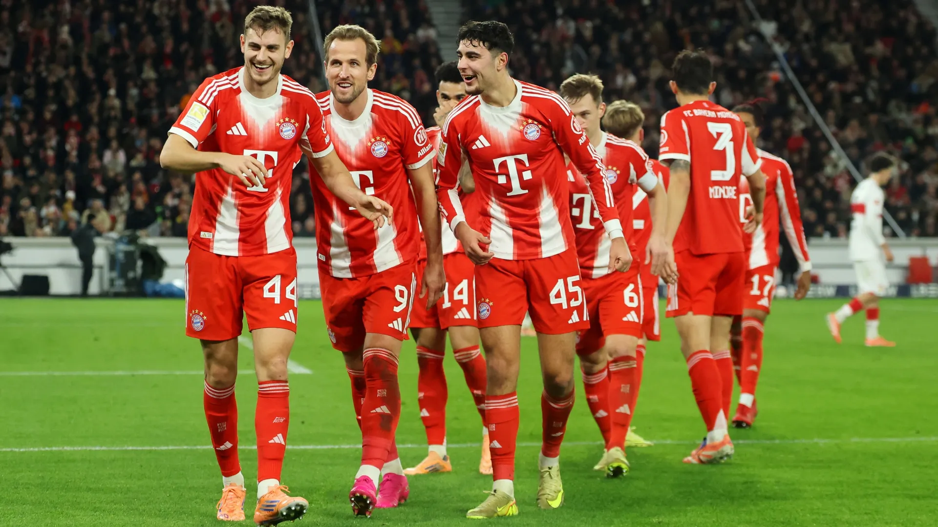 Josip Stanisic of FC Bayern Munich celebrates scoring his team’s third goal with teammates. Alex Grimm/Getty Images
