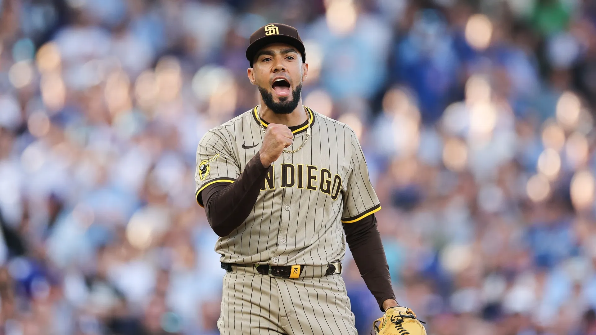 Robert Suarez #75 of the Padres celebrates after defeating the Cubs. Michael Reaves/Getty Images