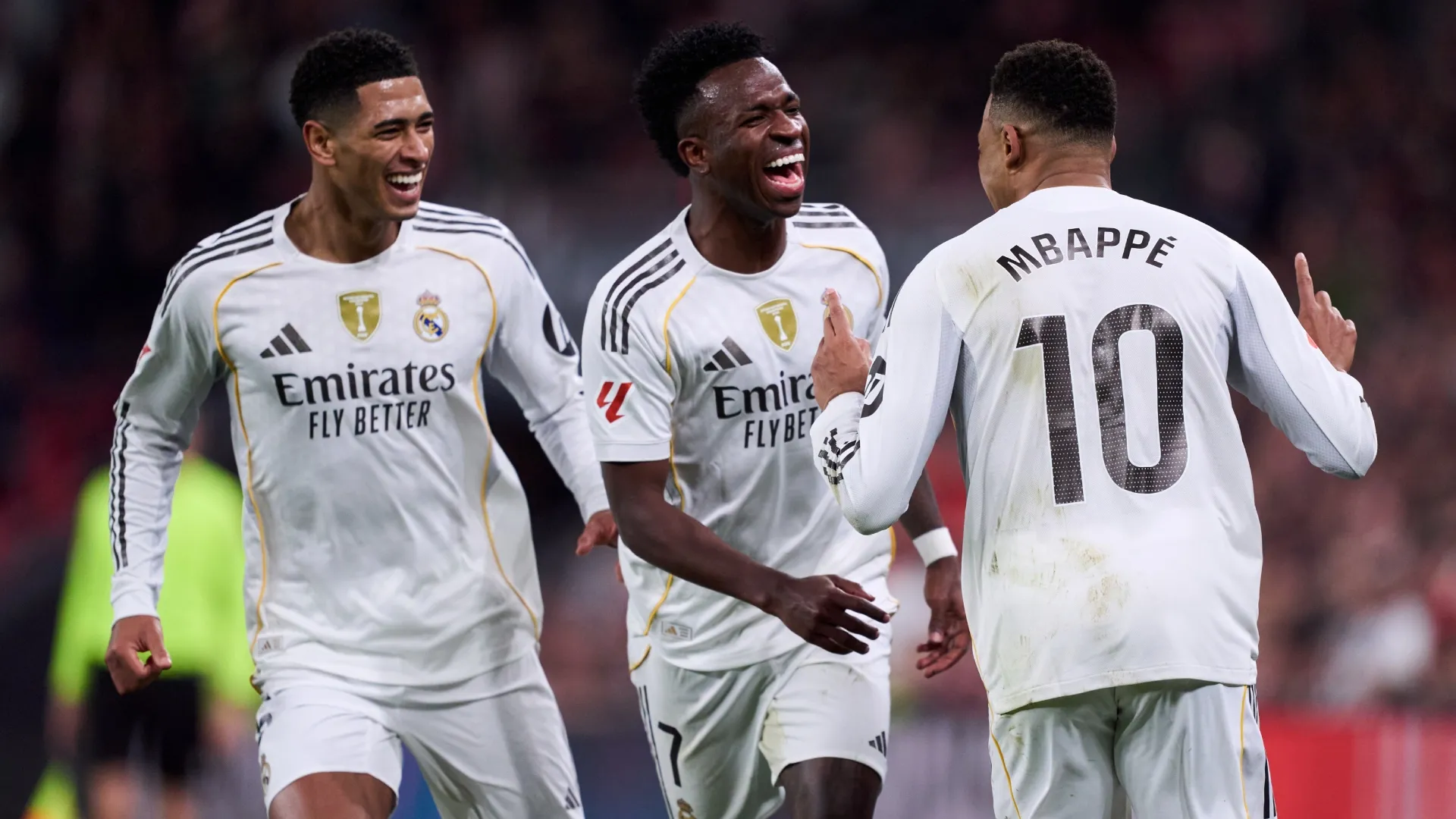 Kylian Mbappe of Real Madrid celebrates scoring his team’s third goal with teammates Vinicius and Bellingham.  Juan Manuel Serrano Arce/Getty Images)