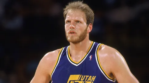 Mark Eaton #53 of the Utah Jazz stands on the court during an NBA game in 1989.