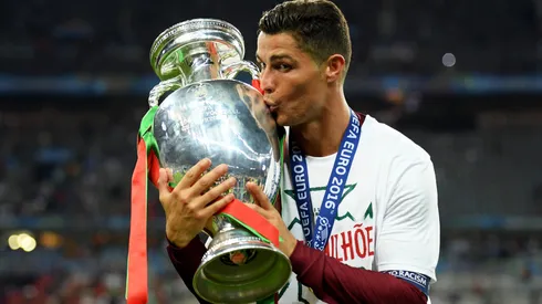 Cristiano Ronaldo of Portugal kisses the Henri Delaunay trophy.