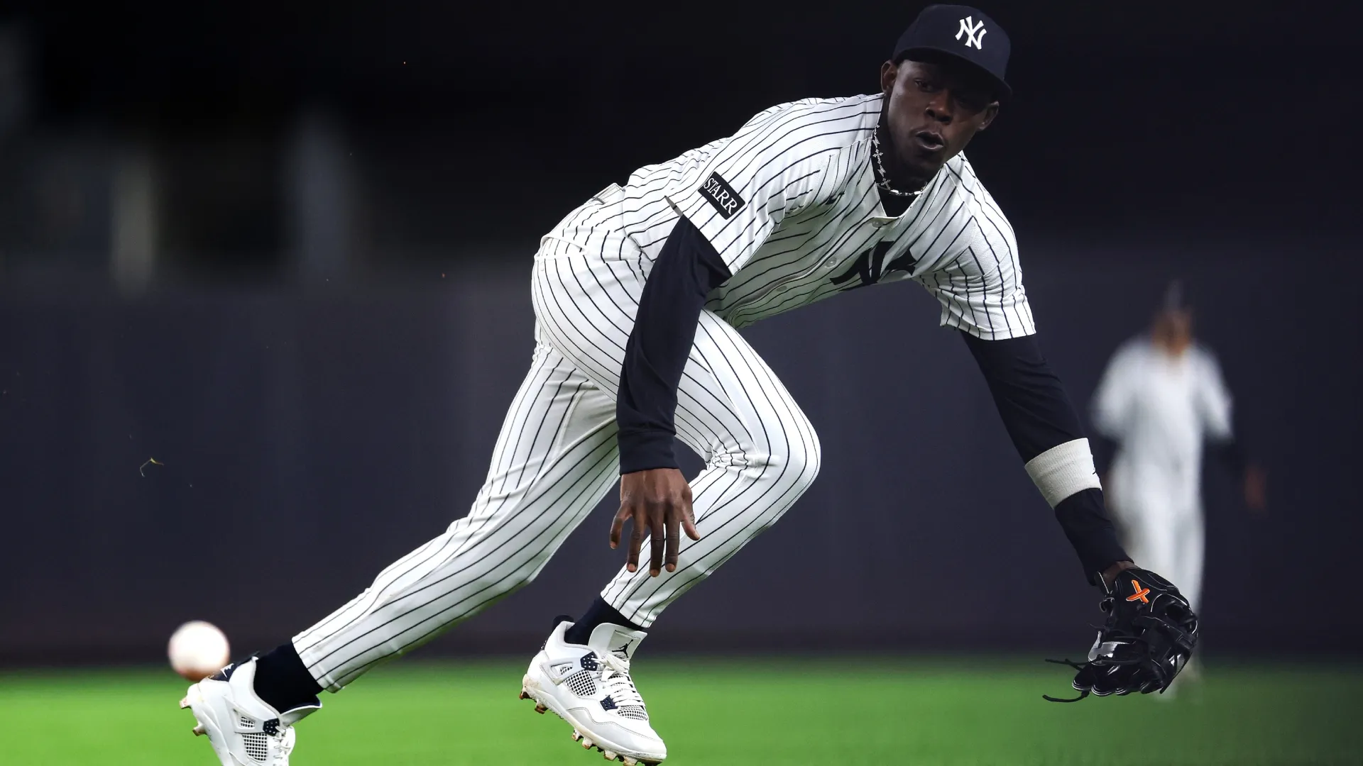 Jazz Chisholm Jr. #13 of the New York Yankees leaps for the ball. Ishika Samant/Getty Images