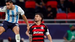 Mohamed Chibi of Pyramids FC heads the ball whilst under pressure from Giorgian de Arrascaeta of CR Flamengo.
