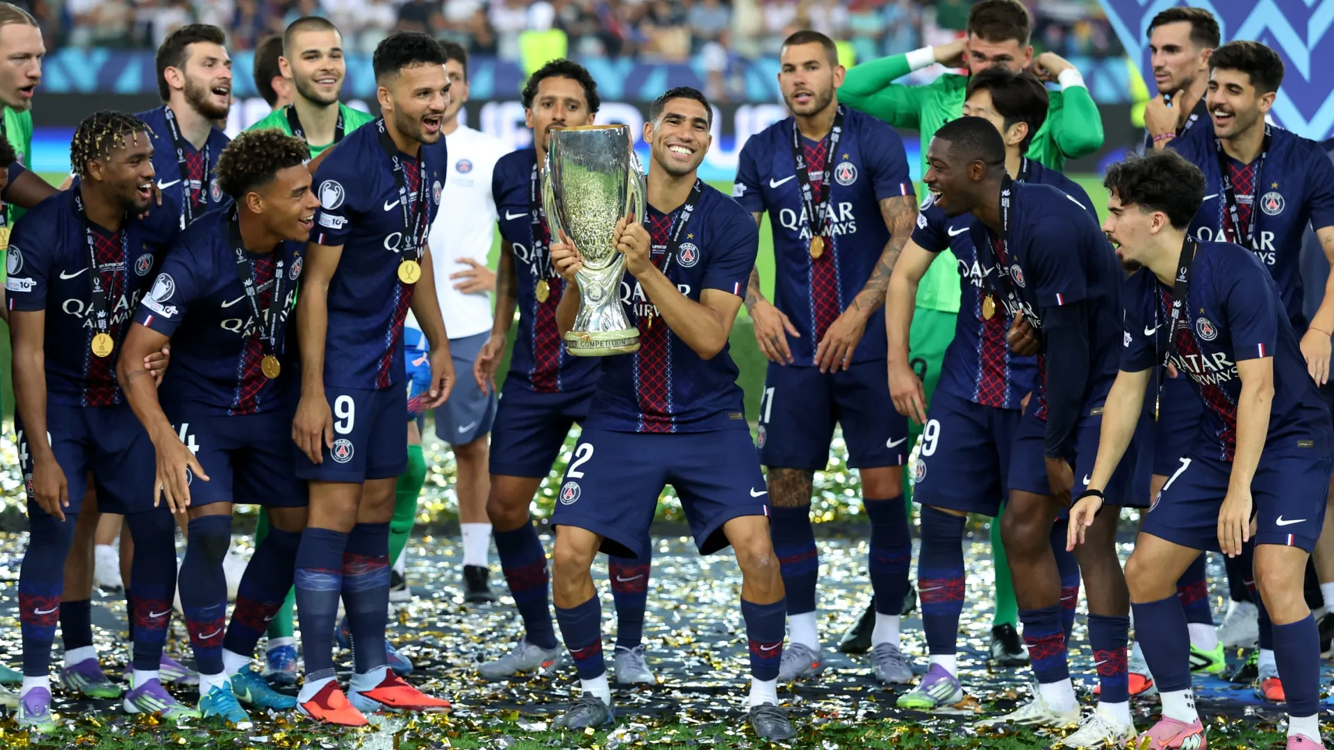 Achraf Hakimi of Paris Saint-Germain celebrates with the UEFA Super Cup trophy. Claudio Villa/Getty Images
