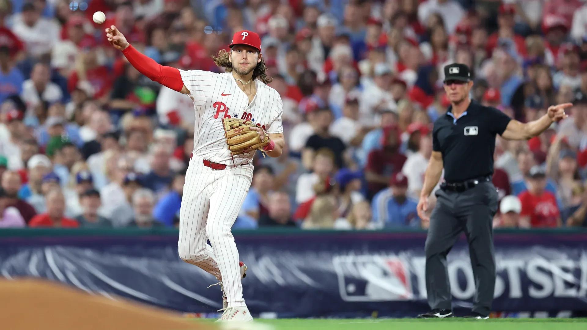Alec Bohm #28 of the Phillies throws to first base. Emilee Chinn/Getty Images