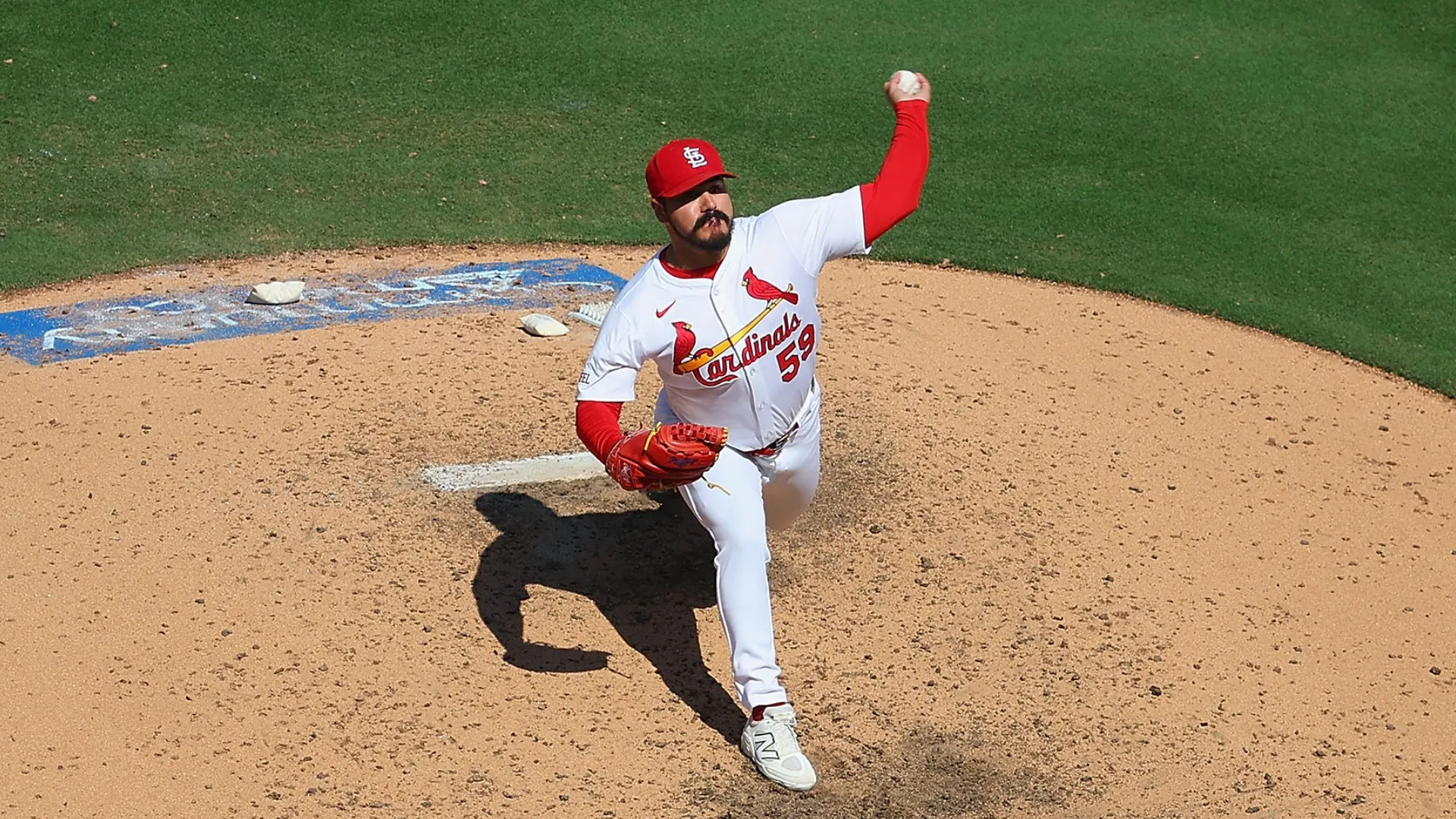 JoJo Romero #59 of the Cardinals delivers a pitch against the Rockies. Dilip Vishwanat/Getty Images