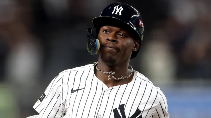 Jazz Chisholm Jr. #13 of the New York Yankees reacts after hitting a solo home run.