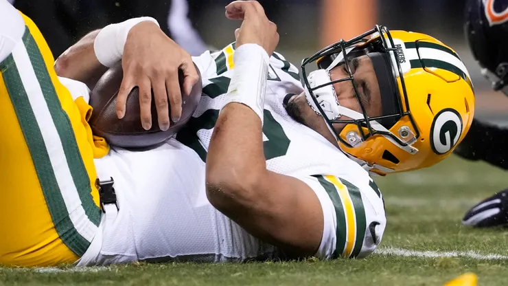 Jordan Love reacts after being hit during the 2nd quarter vs the Bears on December 20, 2025 in Chicago.