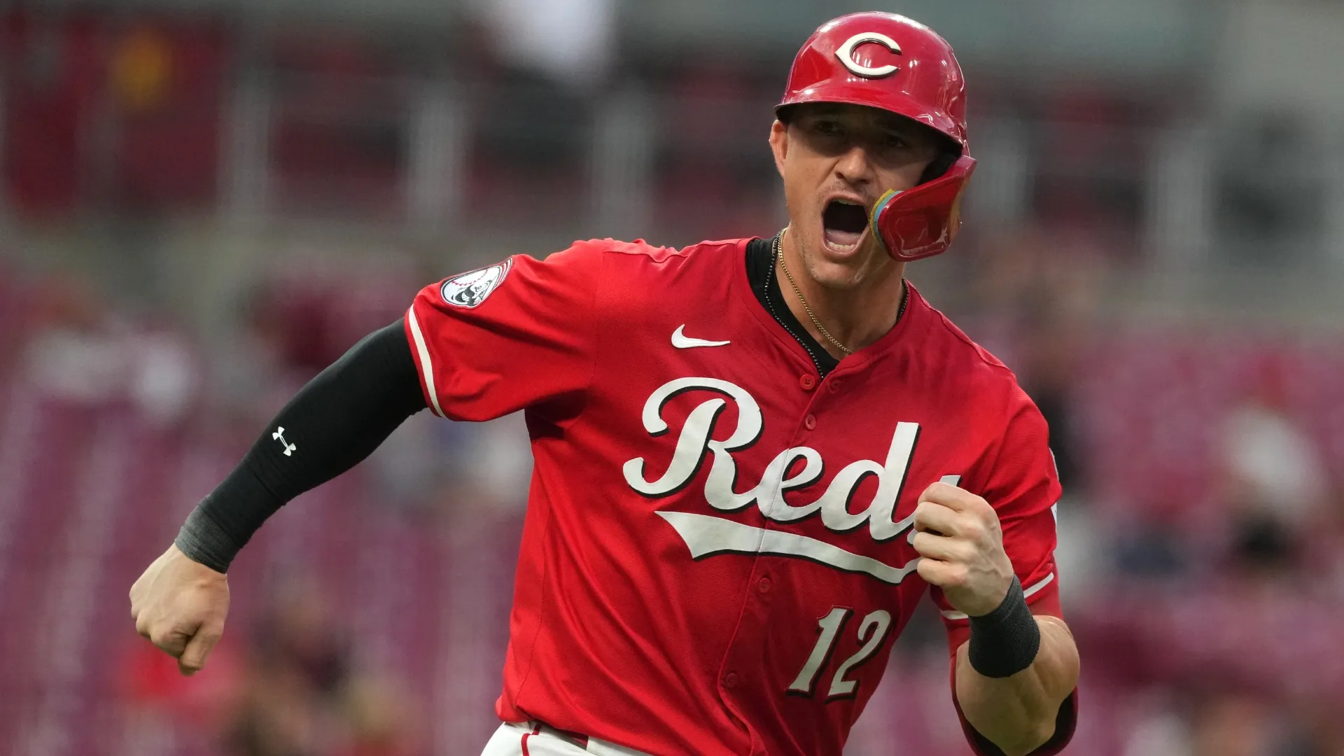 Austin Hays #12 of the Cincinnati Reds reacts to hitting a three-run home run. Jason Mowry/Getty Images