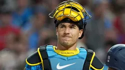 J.T. Realmuto #10 of the Philadelphia Phillies reacts after committing a throwing error.