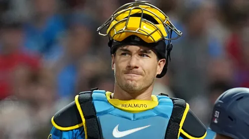 J.T. Realmuto #10 of the Philadelphia Phillies reacts after committing a throwing error.