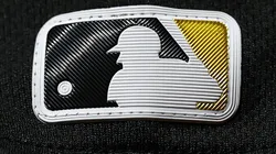 The Major League Baseball logo is seen on a uniform.