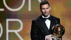 Lionel Messi receives the 2021 Ballon d'Or.