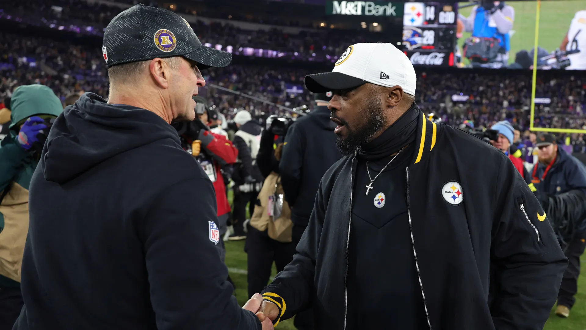 John Harbaugh shakes hands with Mike Tomlin. (Getty Images)